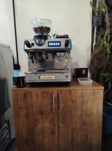 a blender sitting on top of a wooden cabinet at Casa Coffice in Bogotá
