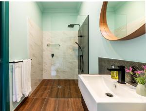 a bathroom with a white sink and a shower at Tuck Inn Yarra Valley in Healesville +38 photos
