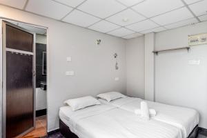 Postel nebo postele na pokoji v ubytování Subang Valley