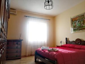 Postel nebo postele na pokoji v ubytování Kalispéra B&B