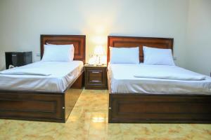Giường trong phòng chung tại Kmt Hostel