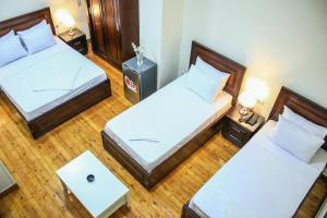 Giường trong phòng chung tại Kmt Hostel