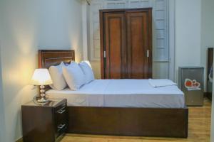 Giường trong phòng chung tại Kmt Hostel