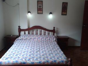 A bed or beds in a room at Hotel Ruma