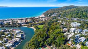 an aerial view of a town next to the water at Laidback luxury living, Noosa Heads in Noosa Heads