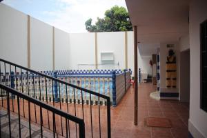 a room with a pool with blue water at HOTEL ANAPOIMA PLAZA IN in Anapoima