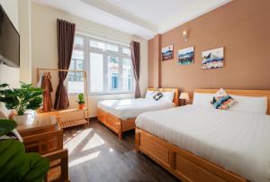 Postelja oz. postelje v sobi nastanitve Moc Thach Hostel Dalat