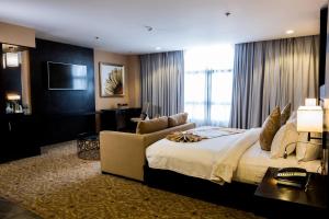 Postel nebo postele na pokoji v ubytování Marcian Garden Hotel