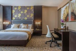 Postel nebo postele na pokoji v ubytování Marcian Garden Hotel