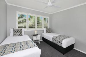 Katil atau katil-katil dalam bilik di Dockside Apartments Mooloolaba