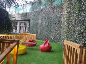 a room with three plastic bags on the grass at Kasauli Castle Resort in Kasauli