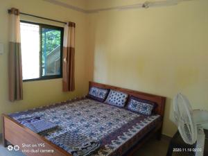 Łóżko lub łóżka w pokoju w obiekcie Athang sea face home stay