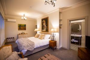 a bedroom with a bed and a mirror at The Rivulet in Hobart