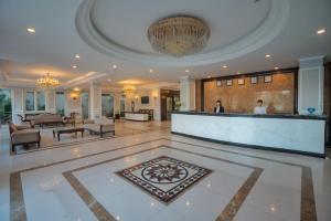 a lobby with a reception desk in a building at Hoian Sincerity Hotel & Spa in Hoi An