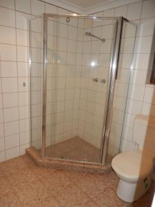 a bathroom with a shower and a toilet at Gnaraloo Station - Homestead in Carnarvon