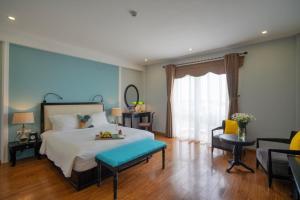 Postel nebo postele na pokoji v ubytování Hoian Sincerity Hotel & Spa