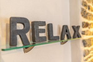 a sign that says raax hanging on a wall at Chalet Ramona in Grächen