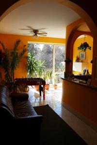 a living room with a couch and a table at Dom Wczasowy Anna in Rabka