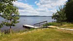 a dock in the middle of a body of water at Kauppilan Rantasauna in Ikaalinen