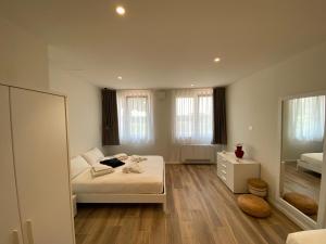 a bedroom with a bed and a mirror at Appartamenti Villa Andrea in Garda