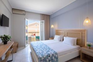 Voodi või voodid majutusasutuse Hotel Rossis toas