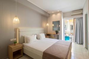 Voodi või voodid majutusasutuse Hotel Rossis toas