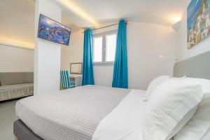 Voodi või voodid majutusasutuse Central Fira Suites toas