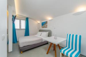 Voodi või voodid majutusasutuse Central Fira Suites toas