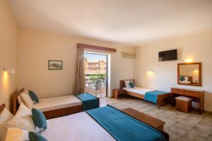 Voodi või voodid majutusasutuse Hotel Rossis toas