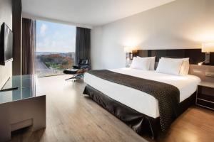 Posteľ alebo postele v izbe v ubytovaní Eurostars Palace
