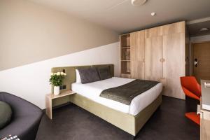 Ένα ή περισσότερα κρεβάτια σε δωμάτιο στο Cavalieri Art Hotel