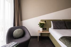 Ένα ή περισσότερα κρεβάτια σε δωμάτιο στο Cavalieri Art Hotel