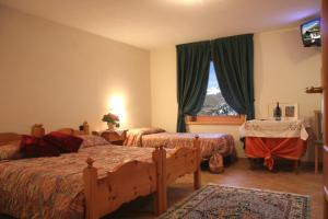 Postel nebo postele na pokoji v ubytování Hotel La Colombina