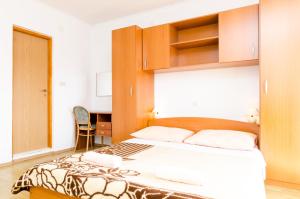 Postel nebo postele na pokoji v ubytování Apartmani Popović