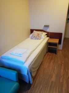 Postel nebo postele na pokoji v ubytování Kirkenes Hotell