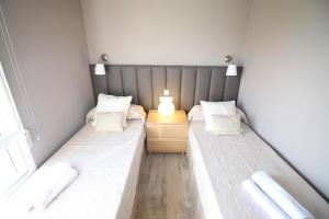 Posteľ alebo postele v izbe v ubytovaní Apartamento Voramar