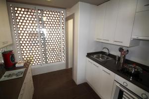 Kuchyňa alebo kuchynka v ubytovaní Apartamento Voramar