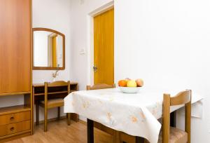 Postel nebo postele na pokoji v ubytování Apartmani Popović