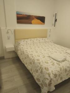 A bed or beds in a room at VV Canteras Sol y Playa