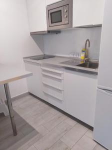A kitchen or kitchenette at VV Canteras Sol y Playa