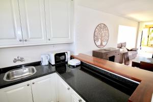 A kitchen or kitchenette at Apartamento El Tridente