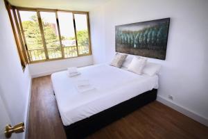 A bed or beds in a room at Apartamento El Tridente