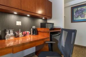a bar in a hotel room with a chair at Hotel Penticton, Ascend Hotel Collection in Penticton