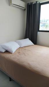 Ein Bett oder Betten in einem Zimmer der Unterkunft AP na Praia de Ponta de Campina, Cabedelo PB