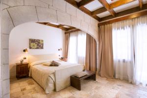 Voodi või voodid majutusasutuse UNA HOTELS Regina Bari toas