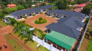 an overhead view of a house with solar panels on it at MAMIKKI Hotel Apartments in Tororo