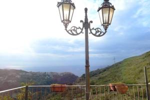 a street light with a view of a mountain at La dimora di Titiro in Cetraro