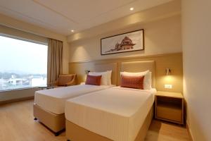 Lemon Tree Hotel, Jhansi客房内的一张或多张床位