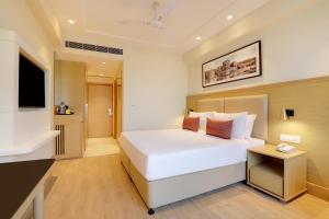 Lemon Tree Hotel, Jhansi客房内的一张或多张床位