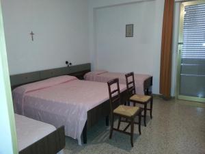 Postel nebo postele na pokoji v ubytování GFH - Hotel Spiaggia D'Oro